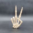 20230606_230658.jpg Skeleton Hand Peace Sign