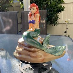 Little Mermaid enjoys some music