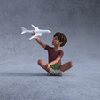 boy-plane1.png Boy sitting playing with toy plane