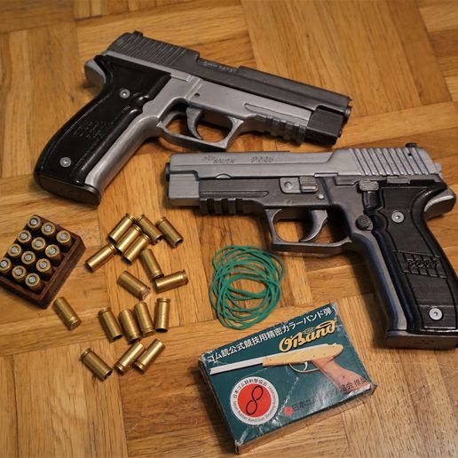 Blowback and shell ejecting rubber band gun (Sig Sauer P226)