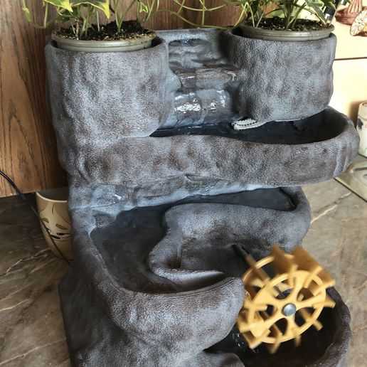 IMG_1217.jpg Homemade waterfall with plants.