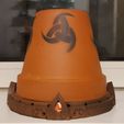 20221210_234328.jpg Viking themed terracotta pot tealight heater
