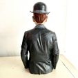 I.jpg Surrealist Mystery Bust – Magritte-Inspired 'Son of Man' Sculpture