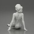 3DG-0010.jpg Femme sexy assise en bikini sur la plage