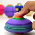 0dfcbec3206bf79a.webp HelixCore – Press-to-Spin Squishy Ball