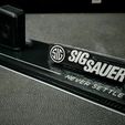 346823755_1288481412085672_2321682141769720098_n.jpg Sig Sauer P320 Stand With Logo