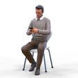 ManSitiing_1.12.6.jpg A Man sitting on a chair with smartphone