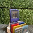 441216194_833505255466581_3887390240266608970_n.jpg GAMEBOY COLOR HOLDER / STAND WITH 8 GAME CARTRIDGES CASES