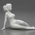 3DG-0008.jpg Femme sexy assise en bikini sur la plage