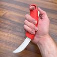 Holding-one-open.jpg Toy OTF Karambit Switchblade (Double Action)