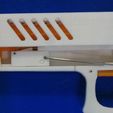 97302854fa86b151d8a4f6ed8fe271cd_display_large.JPG Pistola de goma con acción Blowback