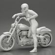 3DG-0007.jpg Motorbiker standing pushing his motorbike