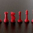 Red_pieces_A.jpg Chess pieces with board