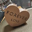 IMG_20230222_215818.jpg A heart-shaped box with the words "FOREVER LOVE"