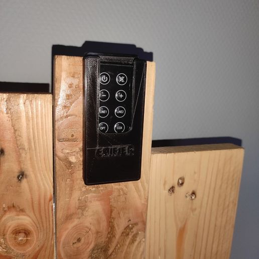 b671c1af-15bf-4069-a42d-1a3b92a655b2.jpg Remote control speaker holder