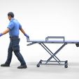 AW1-1.1.18.jpg N1 Ambulance worker pulling wheeled stretcher or trolley
