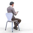 ManSitiing_1.12.91.jpg A Man sitting on a chair with smartphone