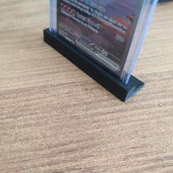 5cd29a8a-89e2-4804-ab3d-6168963d0cbc.jpg Card holder under toploader pokemon lorcana magic