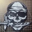 e278e272-22c9-483f-a19e-e85311632f28.jpg pirate skull with knife in mouth