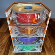 four_stack_bags.jpeg Vertically Stackable 3D Printed Filament Shelves.