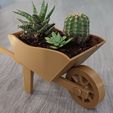 wheelbarrow-2.jpg wheelbarrow shaped planter for succulents