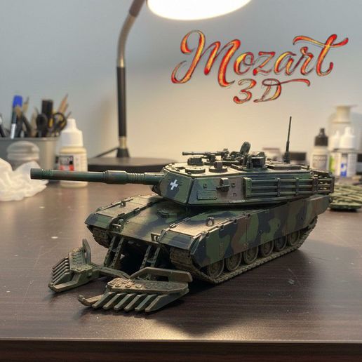 Modern battle tank with mine plow