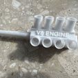 IMG_9242.jpg V8 engine keychain for smoking 8 cigarettes at once.