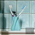 TREFLE_toothbrush-holder_Front-blue-tiles.jpg TREFLE | Toothbrush stand
