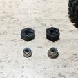 IMG_0531.jpg JJRC Q46 12mm hexagon adapters for track widening (1.5mm thicker)