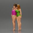3DG-0006.jpg Two girl in bikini hugging on the beach