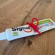 photo.jpg TOOTHPASTE EXTRUDER