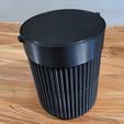 Trash can with swing lid