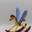 PXL_20260216_203737140.jpg Alice in Wonderland rocking horse figurine
