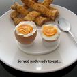 eat_display_large.jpg Boiled Egg Server - Neatly holds both parts of a cut boiled egg while it's being eaten.
