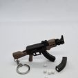 20250902_000140.jpg AK-47 Keychain — Functional Blaster Toy
