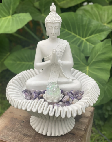 Captura-de-tela-2026-01-31-150313.png Buddha figurine in a lotus flower.