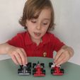 IMG_20221030_194805.jpg keychain, phone holder and formula 1 car toy