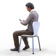 ManSitiing_1.12.46.jpg A Man sitting on a chair with smartphone