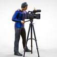 Cameraman2.1.jpg N2 Cameraman avec chapeau et casque caméra sur trépied
