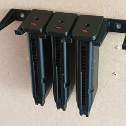 WhatsApp_Image_2019-04-30_at_21.43.19_1.jpeg Free STL file Glock Magazine Wall Holder・3D printable object to download