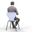 ManSitiing_1.12.81.jpg A Man sitting on a chair with smartphone