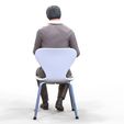 ManSitiing_1.12.71.jpg A Man sitting on a chair with smartphone