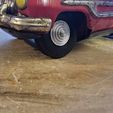 0dfaad6d-f3b2-4506-a370-67bdc401e962.jpg Replacement wheel for vintage tin toy car