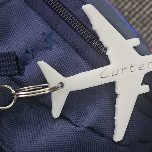 1000005236.jpg plane keychain