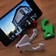 01068922-01.jpeg Foldable phone holder with decaps