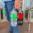 IMG_1242.jpg Bottle Buddy: Universal Soda Bottle Carrier with Ergonomic Handle & Magnetic Storage – Fits Most 1L to 2L Bottles Worldwide