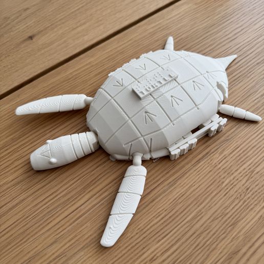 White-3D-printed-parametric-OpenSCAD-braille-sea-turtle-counting-abacus-with-articulated-flippers-ta.jpg Braille Sea Turtle Counting Abacus. Print in Place Articulated Turtle with Sliding Number Tiles in the Shell Rim and Braille Word Plate, Parametric OpenSCAD, with Flexi Braille Turtle Variant