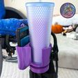 460225105_555844263684865_5292027129297024178_n.jpg Taza para silla de ruedas + soporte para teléfono