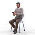 ManSitiing_1.12.11.jpg A Man sitting on a chair with smartphone