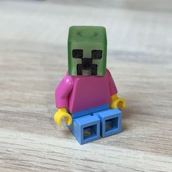 Creeper-Head-on-Lego-Body-Sitting.jpg The Head of Creeper from Minecraft - a Lego compatible model